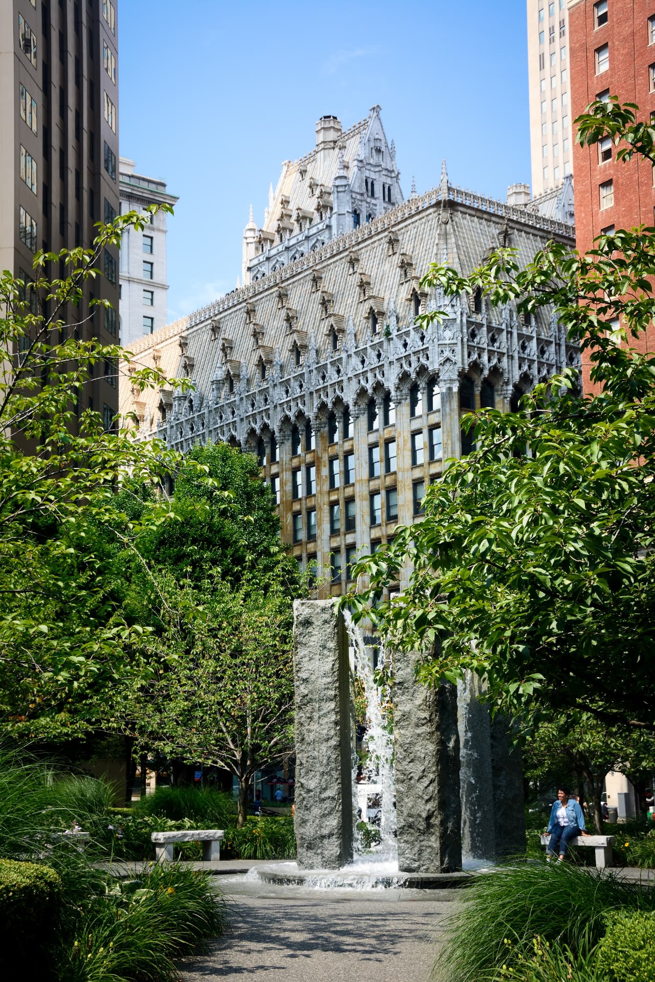 Gothic Pittsburgh landmark rising above a downtown park fountain
