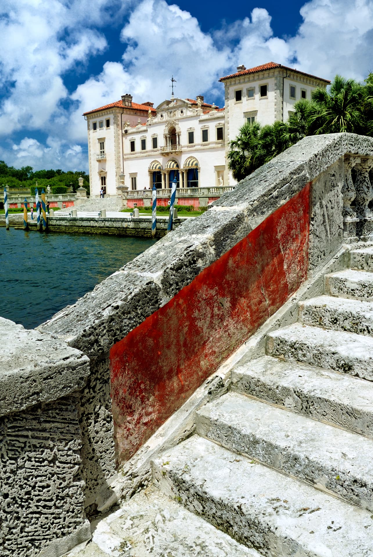 Coral stone stairway leading up toward a historic bayfront villa